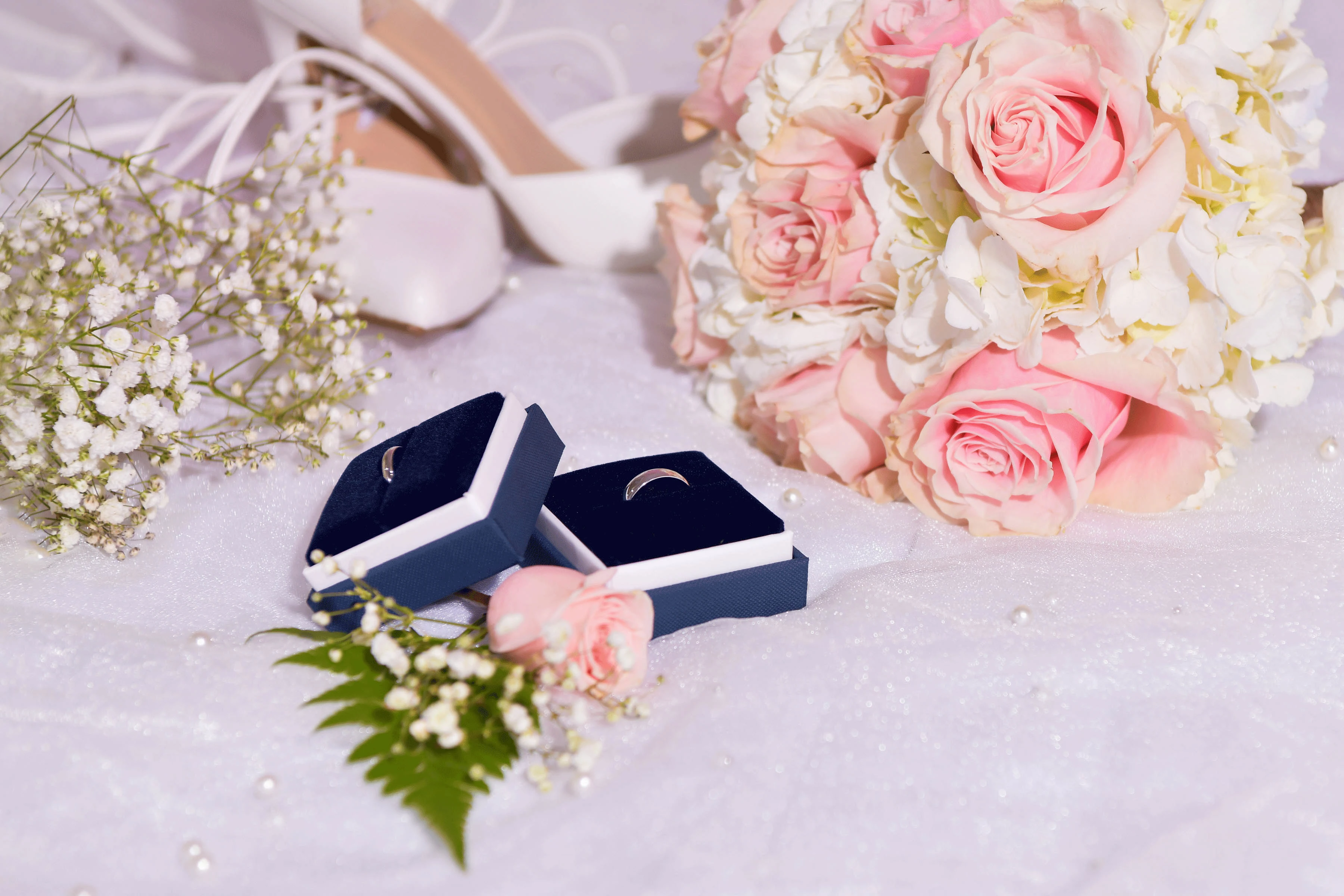 Bouquet, rings, and shoes ready for the big day at Media Luna Ranch—where weddings are filled with love and elegance.